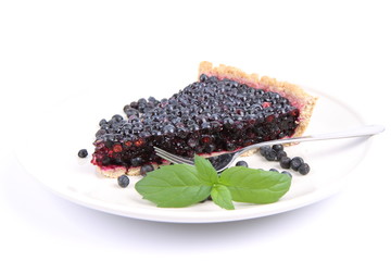 Blueberry Tart: a portion on a plate decorated with mint