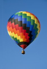 Colorful hot-air balloon against blue sky
