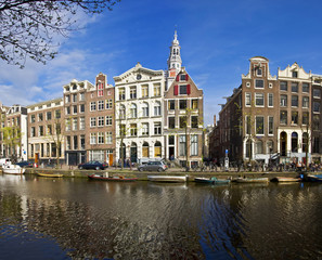 Fototapeta na wymiar Amsterdam Life. Residential homes on the canal.
