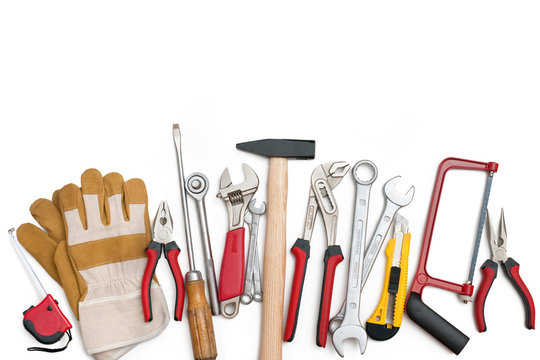 Assorted building tools over a white background