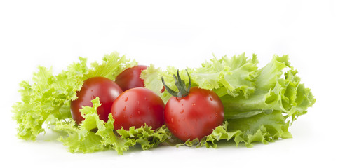 Tomatos and green salad leaves