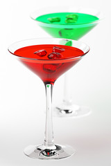 Martini glass with red and green  coctails isolated on white