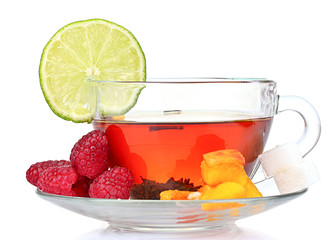 black tea in cup, lime, peach and raspberry isolated on white