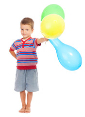 Smiling little boy with color balloons