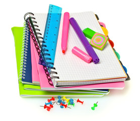 notebooks, paper clips, ruler, and markers isolated on white