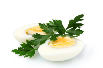 boiled egg and parsley on plate isolated on white