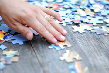 Jigshaw puzzle done on a wooden table