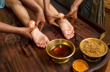 traditional indian ayurvedic oil foot massage - obrazy, fototapety, plakaty