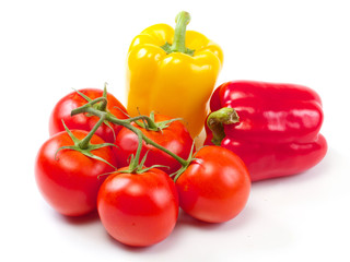 Fresh sweet pepper, tomato. On a white background.