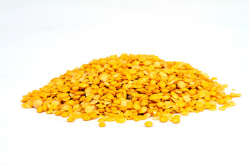 Yellow lentils isolated on white background.Macro shot.
