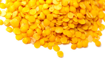 Yellow lentils isolated on white background.Macro shot