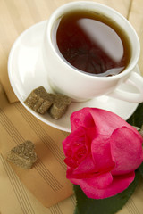 A cup of tea and rose