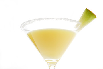 Yellow fruit cocktail over white.