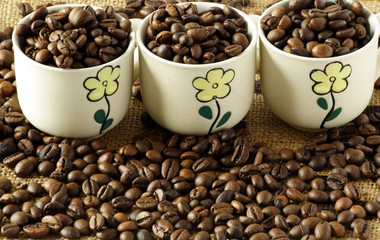 Coffee cups with coffee beans