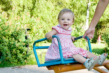 smiling child on swing