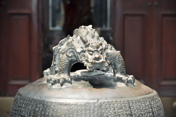 ornamental chinese bronze fable animal atop of a bell