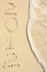 The Year 2012 Written in Sand on Beach