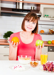 beautiful woman holding a apple and orange
