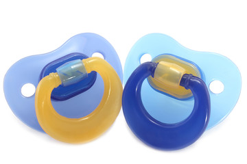 Two pacifiers close-up - obrazy, fototapety, plakaty