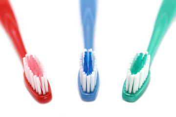 Three tooth brushes