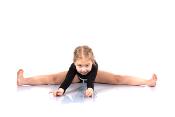 Fototapeta na wymiar Studio portrait of girl gymnasts, stretching
