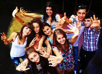 A group of young people dancing at a disco.