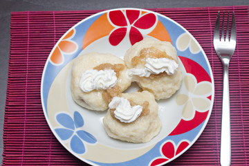 Obraz na płótnie Canvas sweet dumplings filled with fruits on the plate