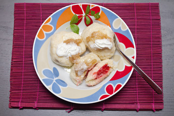 sweet dumplings filled with fruits on the plate