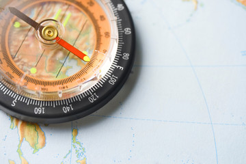 Compass on the map background