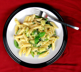 Creamy Macaroni pasta on  red background