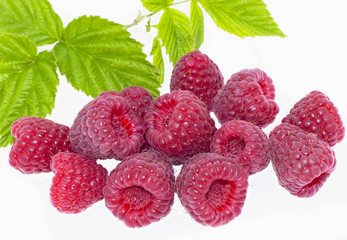 Bright raspberry with leaves on a white background