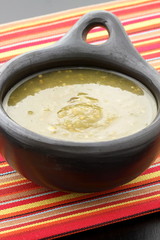 tomatillo sauce in colombian clay dish