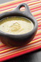 tomatillo sauce in colombian clay dish
