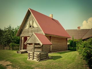 wooden house and well in the yard