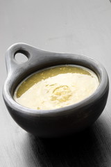 tomatillo sauce in colombian clay dish