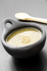 tomatillo sauce in colombian clay dish