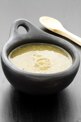 tomatillo sauce in colombian clay dish