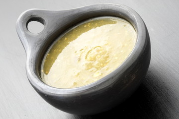 tomatillo sauce in colombian clay dish