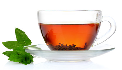 black tea  and mint in cup isolated on white