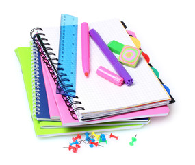 notebooks, paper clips, ruler, and markers isolated on white