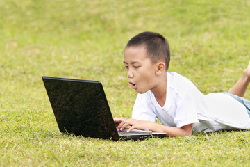 Shocked kid on laptop