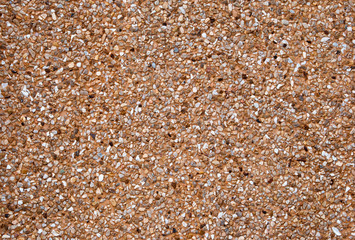 Pebble dashed concrete wall.