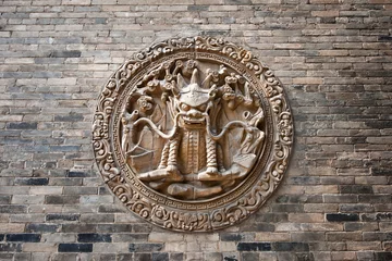 Fotobehang Chinese classic brick wall with animal detail © wusuowei