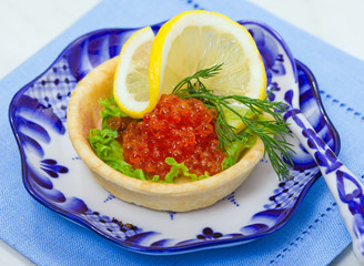 Tart with red salmon caviar