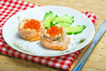 Appetizing of salmon fish with red caviar