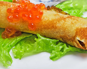 Russian pancakes with salmon red caviar