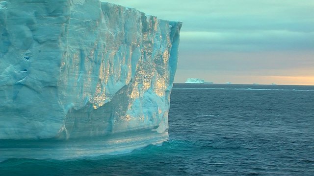 tabular iceberg in morning sun