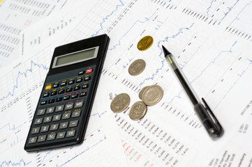Calculator, money, graph and pencil