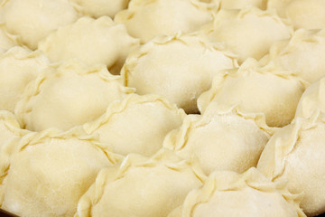 Fototapeta na wymiar Uncooked dumplings with potato
