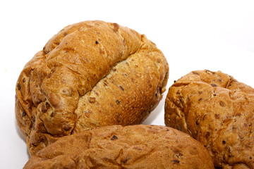 Loaf of bread and rolls isolated on white